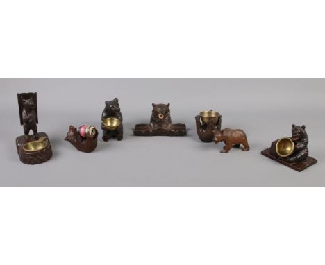 A collection of Black Forest and similar bears, to include ashtray, inkwell and pen holder and bobbin holder.  