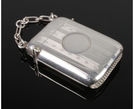 A George VI silver vesta case with engine turned decoration. Assayed Birmingham 1939 by  Joseph Gloster Ltd. 22g.  