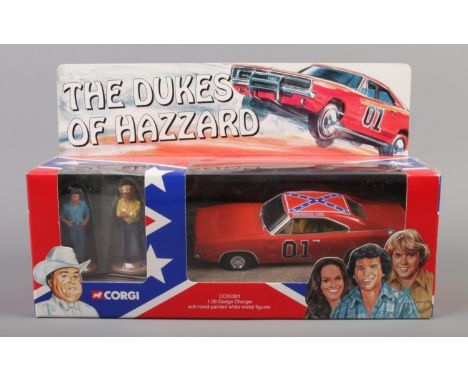 Corgi - A Dukes of Hazzard set consisting of a 1:36 scale Dodge Charger and hand painted white metal figures.  Box, figures a