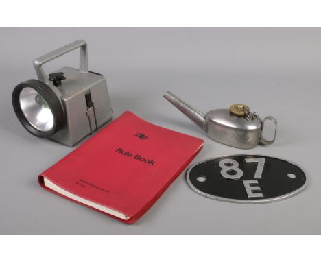 A collection of railwayana. Includes NRS bardic lamp, flare lamp, locomotive shed plate and a British Railways Board Rule Boo