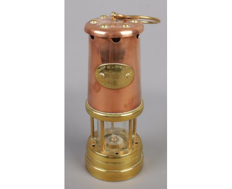 A Lamp &amp; Limelight Company miners lamp.  