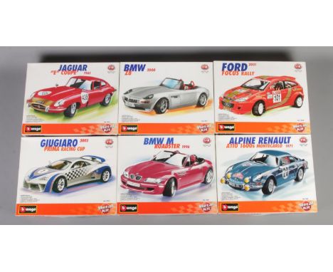 A set of six boxed Burago metal kit scale models. To include 2000 BMW Z8 (1/18), 1961 Jaguar E Coupe (1/18) and 1996 BMW M Ro