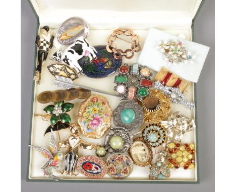 A case of costume jewellery brooches. Includes vintage and Deco examples.  