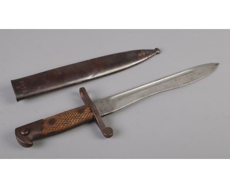 A 1941 Toledo bayonet with scabbard, stamped 6279 E to both pieces. 40cm long.  