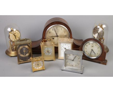 A box of clocks. Including glass dome torsion clock, mantel clocks, alarm clocks, etc.  