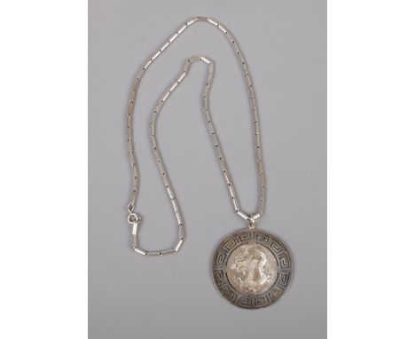 A silver pendant. With Chinese dragon and symbol for long life on reverse (26.98g).  