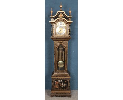 A modern black painted longcase clock. With bird and flower decoration.  