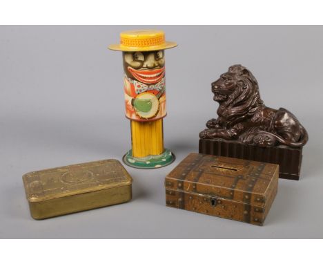 Three vintage money boxes together with 1914 Christmas Day tin. Includes growing money box.  