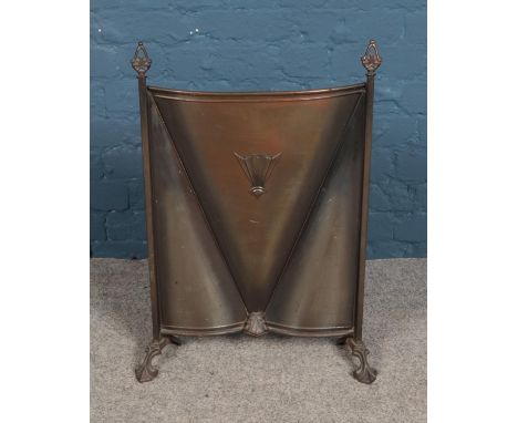 A copper fire screen with Art Deco style motif.  