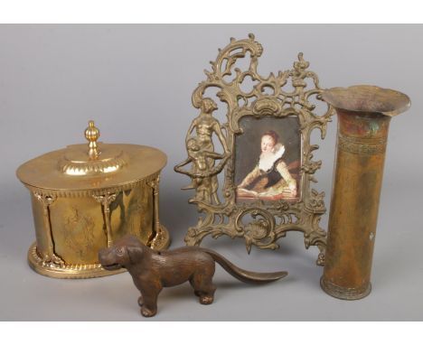 Four pieces of metalware. Including trench art, brass tea caddy, nut cracker formed as a dog, etc.  