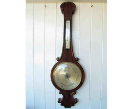 A 19th Century moulded rosewood 10" wheel barometer with moulded long thermometer box, maker C.W. Dixey, Optician to the Quee