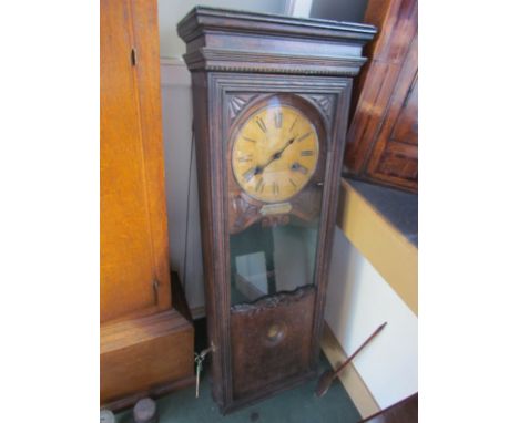 A circa 1900 "Bundy Time Recorder" clock in oak case, key and pendulum