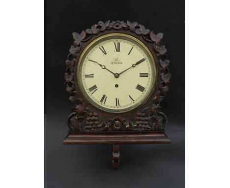A 19th Century mahogany cased dial clock with integrated bracket, case with carved grape and foliate detail, Roman 8" dial si