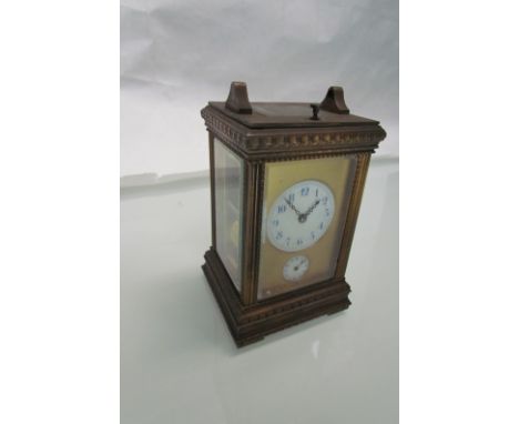 A 19th Century brass carriage clock, Arabic enamel dial with striking, repeat and alarm movement, handle missing, 5" high 