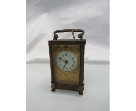 A 19th Century brass carriage clock, Arabic enamel dial with pierced gilt foliate detail, gourge case, 4.5" high (excluding h