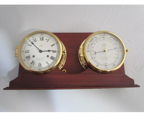 A 20th Century Sewills brass cased ships clock and barometer on mahogany mount 