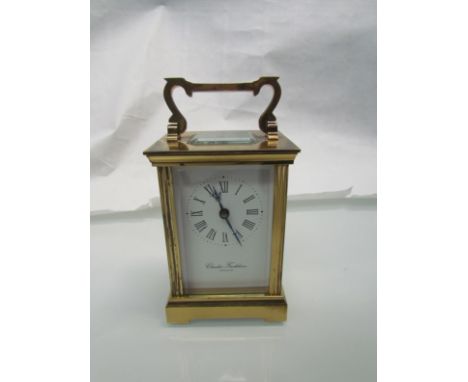 A 20th Century Charles Frodsham brass carriage clock with platform escapement and key 