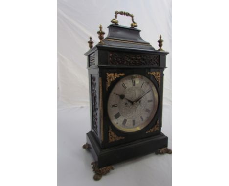 A 19th Century ebonised bracket clock with ormulu mounts, finials, feet and carry handle, engraved silvered Roman dial, 8-day