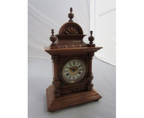 An oak mantel clock of architectural form, 8-day striking movement, Roman enamel chapter ring, 17" high 