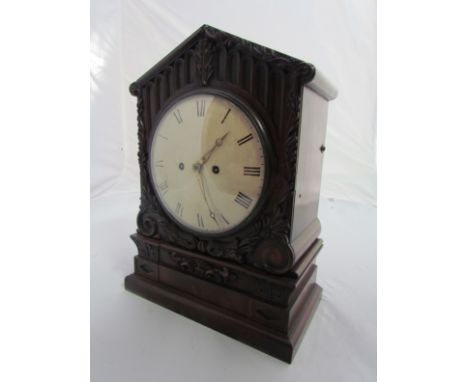 A Georgian mahogany bracket clock with carved decoration a/f, Roman convex dial, maker James McCabe, Royal Exchange London wi