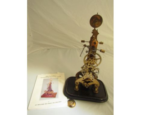A brass skeleton clock with single fusee movement and grasshopper escapement, with manual, 19" high