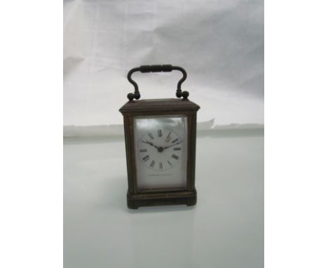A late 19th/early 20th Century miniature brass carriage clock by Camerer Kuss & Co., Roman enamel dial, 3" high (excluding ha