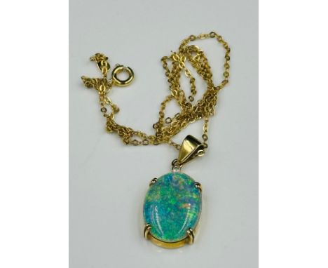 An opal pendant (20mm x 15mm) on a marked 750 setting and fine necklace.