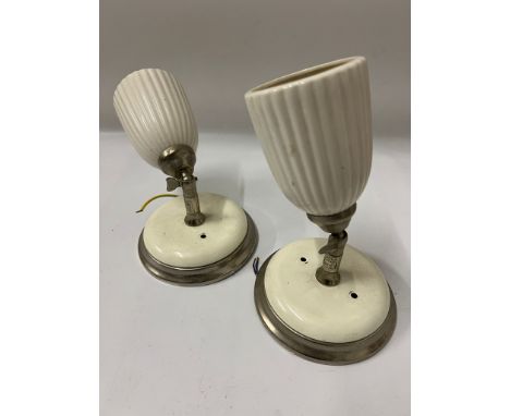 A pair of ceramic cram spot lights with fluted shades and adjustable angles 