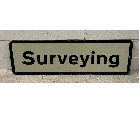An enamel "Surveying" sign 