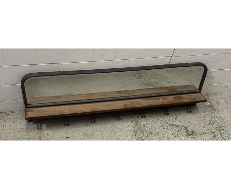 A contemporary wall mounted shelf with hooks and a mirror over (W100cm)
