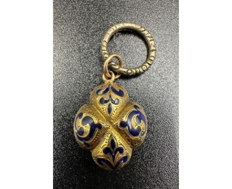 A yellow metal and blue enamel remembrance locket with plaited hair
