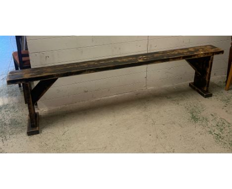A wooden rustic bench (H52cm W220cm D21cm)