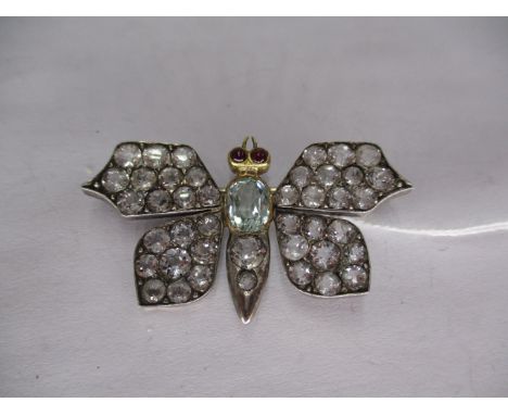 Late Victorian Butterfly Brooch with a Central Faceted Oval Aquamarine, Cabochon Ruby Eyes and Spinel Set Wings Mounted in Wh