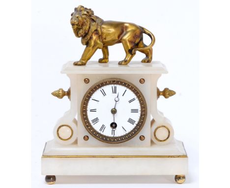 A French alabaster mantle clock, late 19th c, mounted with a giltmetal lion and enamel dial, 26cm h, pendulum and key  
