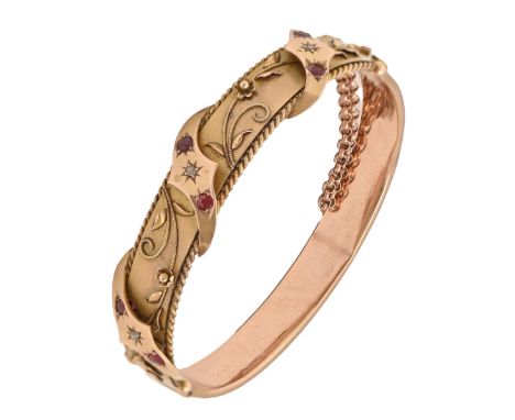 A ruby and diamond bangle, in 9ct gold, gypsy set, 57mm (internal), Birmingham 1911, 12g  Plain lower half creased
