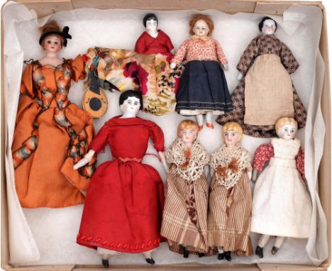 Eight Victorian bisque and glazed porcelain shoulder head dolls,&nbsp;second half 19th c, a Simon &amp; Halbig mould 5160 in 