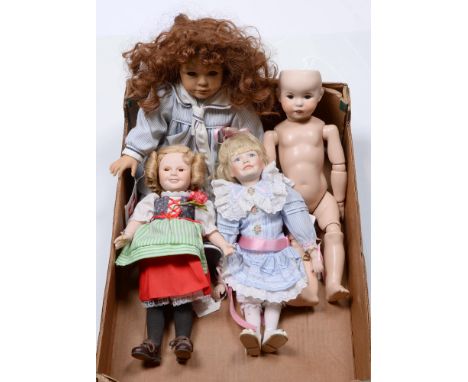 Four bisque, porcelain and vinyl dolls, late 20th c, to include a MBI bisque Shirley Temple doll, c1987, in original clothing