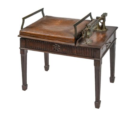 A set of jockey scales, late 19th c, W & T Avery Ltd, the brass mounted leather covered seat on mahogany base with carved fri