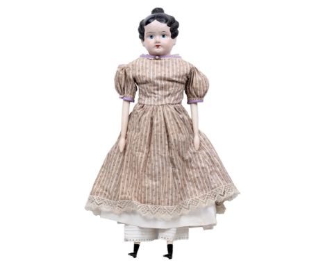 A papier-mache shoulder head doll, c1840, with painted features and moulded hair, on a cloth body with carved wooden arms and