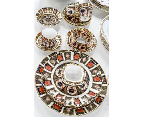 Four Royal Crown Derby Imari pattern plates, three teacups and saucers, coffee cup and saucer, dish and trinket box, early-la