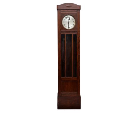 An oak longcase clock, 1930s, with silvered dial, the trunk enclosed by glass door with triple bevelled plate, pendulum, 199c