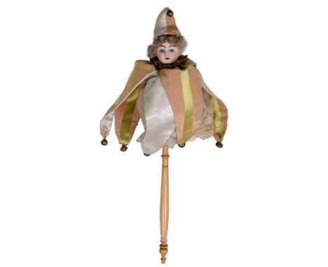 A German musical Marotte, c1890, the bisque head with fixed blue eyes and open mouth with upper teeth, blond mohair wig, on a