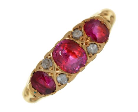A synthetic ruby and diamond ring, in 18ct gold, Chester 1902, 3.1g, size L  Good condition