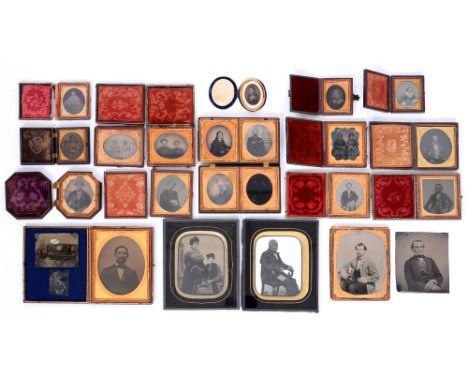 Victorian photography. Twenty-one ambrotypes and two tin types of men, women and children, mid-19th c and later, fifteen case