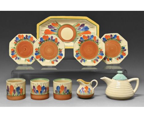 Clarice Cliff. A ribbed teapot and cover and Autumn Crocus pattern teaware, c1930s, dish 29cm l, printed and painted mark  Ch