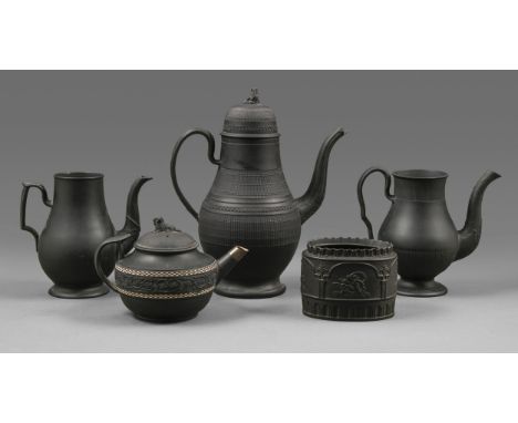 An engine turned black basalt coffee pot and cover of unusually large size, c1790, 31cm h, two other black basalt coffee pots