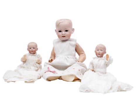 A Gebruder Heubach 8*25 bisque head character doll, c1912, with intaglio eyes, open-closed mouth and moulded hair, on bent li