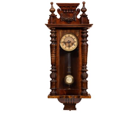 A walnut Vienna wall clock, c1930, giltmetal dial with primrose enamel chapter ring, pendulum, key, 76cm h, an American style