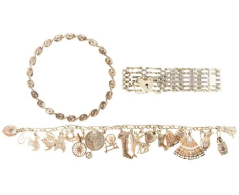 A silver charm bracelet, gate bracelet and bangle, 68g  Good condition