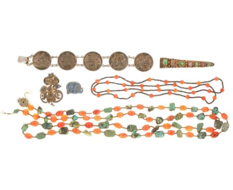 A Chinese jade, rose quartz and silver gilt filigree and enamel finger guard, a Chinese silver bracelet with Shu characters, 